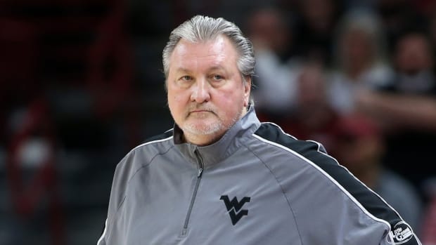 Jan 29, 2022; Fayetteville, Arkansas, USA; West Virginia Mountaineers heat coach Bob Huggins during the first half against the Arkansas Razorbacks at Bud Walton Arena.